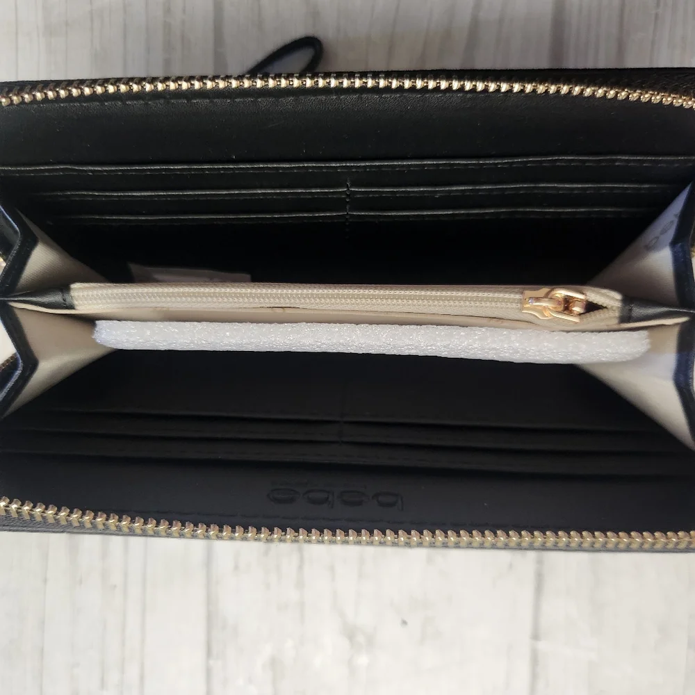 Bebe Women's Wristlet Wallet Quilted Black With Gold Lettering and Rhinestones